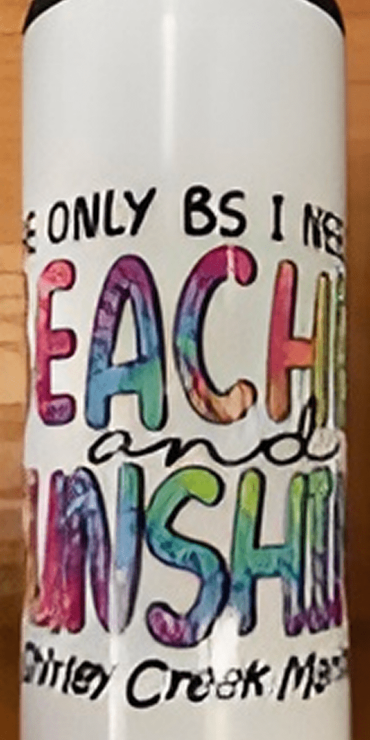 Colorful text on a white bottle