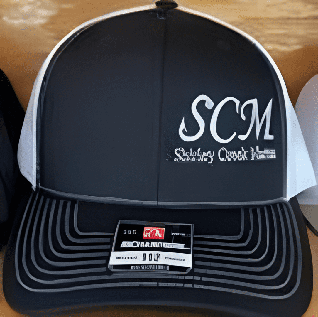 Black and white cap with SCM logo.