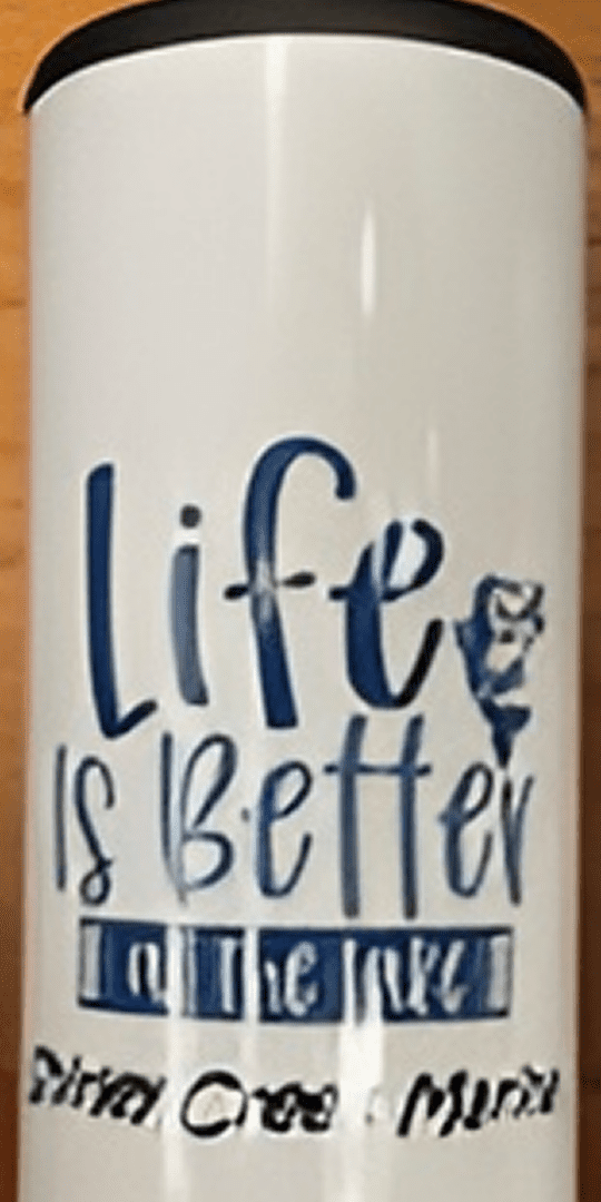 White tumbler with blue lake-themed design