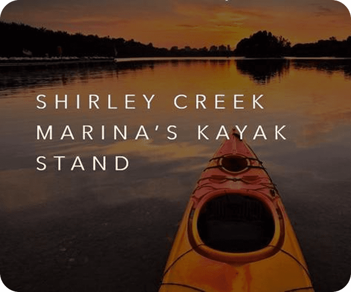 Kayak on calm lake at sunset